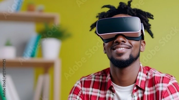 Fototapeta A young casually dressed professional using a virtual reality headset in a bright contemporary office environment exploring the latest digital technologies and innovations