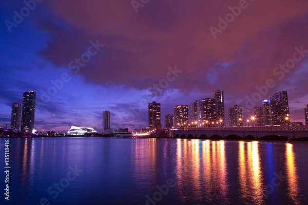 Fototapeta View on Miami Downtown Knight Concert Hall and MacArthur Causeway at night time with a view on a bay, USA