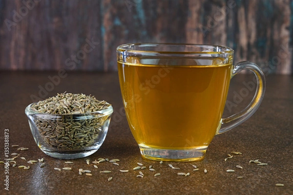Obraz Jeera water also called as cumin water is served in a cup.