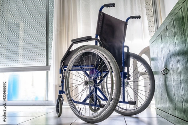 Obraz Empty wheelchair inside a room
