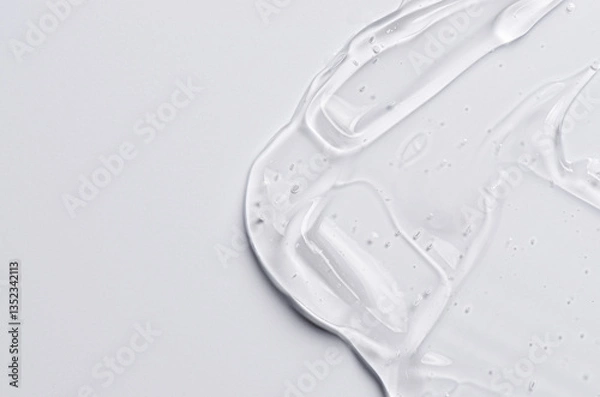 Fototapeta The texture of a cosmetic serum for the face with hyaluronic acid and collagen. Copy space