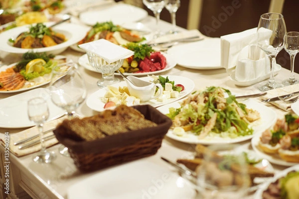 Fototapeta table set service with silverware and glass stemware at restaurant before party