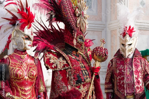Obraz Venice, Italy - People dressed in carnival masks are photographed by tourists in the scenery of the ancient Venetian palaces