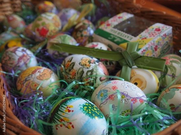 Fototapeta Hand painted Colorful Easter Eggs in Easter Basket