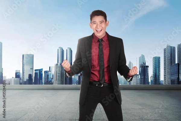 Fototapeta Young asian businessman with happy expression