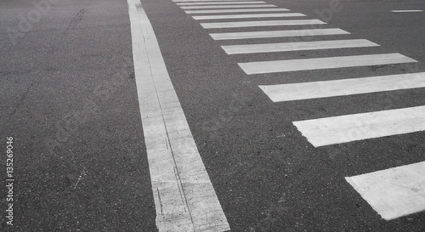 Obraz crosswalk on the raod in the city.