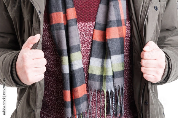 Obraz Close-up of man showing comforter sweater and jacket