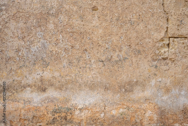 Obraz Processed collage of ancient yellow block wall texture. Background for banner, backdrop or texture for 3D mapping.A rectangular slab of light sandstone against the background of stone fragments as the