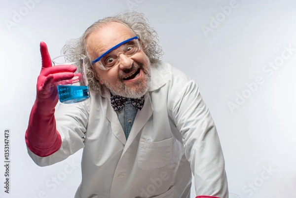 Obraz Mad Scientist in white lab coat holding a flask with blue liquid
