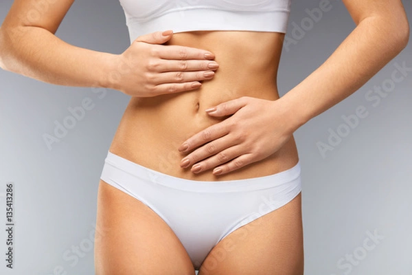 Fototapeta Pain. Beautiful Woman Body Feeling Stomach Ache, Hands On Belly