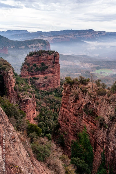 Fototapeta Grey morning at the edge of the cliffs (Sau Reservoir, Vilanova de Sau Spain)