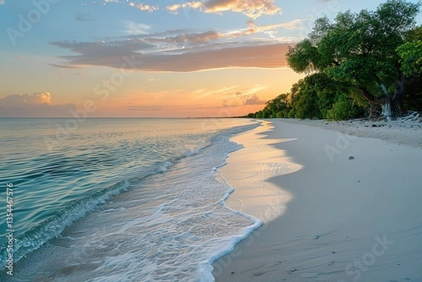Fototapeta A calm, serene beach at sunrise, the water gently lapping the shore, pastel colors in the sky as the first light of day breaks over the horizon