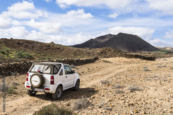 Obraz White off road vehicle in the outback of Fuerteventura Canary Is