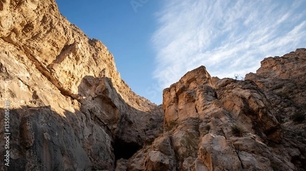 Fototapeta Dramatic rock formations and cliffs against a clear blue sky reflecting natural beauty and rugged terrain : Generative AI