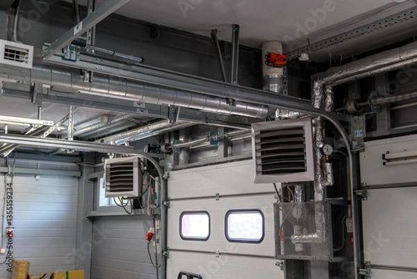 Fototapeta Air heating system for industrial premises, new technologies. pressure regulators and manometers with a system of radiators at the gate