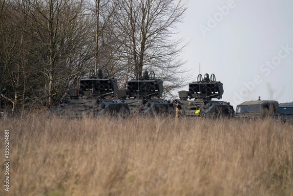 Fototapeta a convoy of British Army Alvis Stormer Starstreak CVR-T tracked armoured vehicle equipped with short range air defense high-velocity missile system