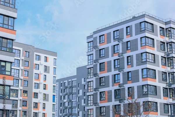 Obraz The concept of modern architecture, residential complex, apartment buildings for living. Multi-storey, apartment buildings of the residential complex in a single architecture in gray and white tones