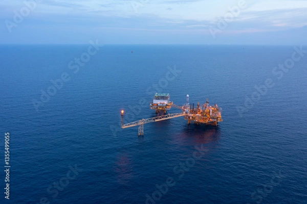 Fototapeta Central processing platform (cpp) in the middle of the ocean during sunset time - upstream industry.
