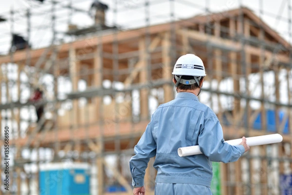 Fototapeta 住宅建築工事を点検する現場監督