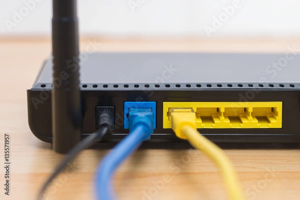 Fototapeta Wireless modem router with cable connecting