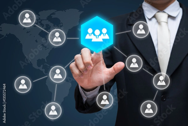 Fototapeta Businessman hand touch businessman icon network - HR,HRM,MLM, teamwork & leadership concept
