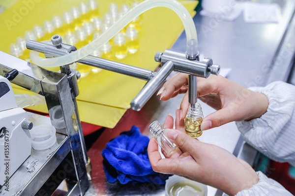 Obraz Filling the bottles