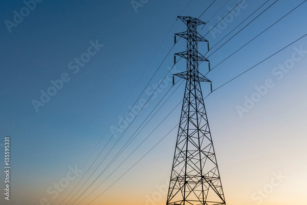 Fototapeta high voltage post.High-voltage tower sunset background.