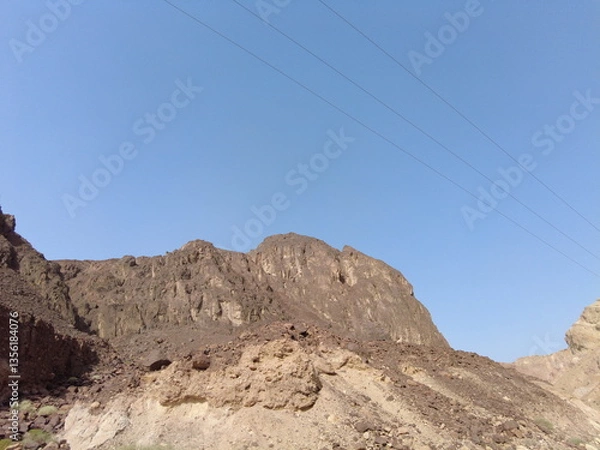 Obraz Rocky mountain landscape against a clear blue sky, showcasing the natural beauty of a desert area in a dry environment