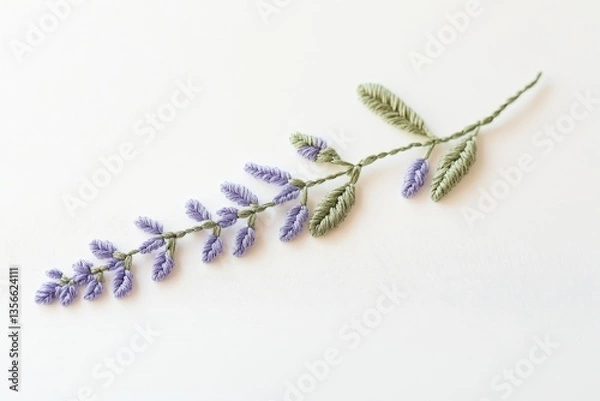 Fototapeta Delicate lavender sprig embroidered on white fabric using French knots and stem stitch.