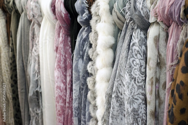 Fototapeta A set of colorful scarves on a rack