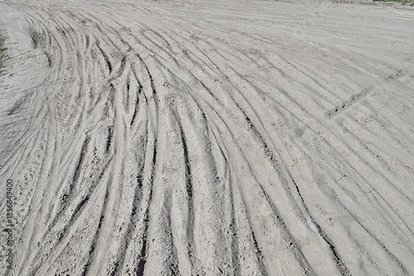 Fototapeta Multiple Bicycle tire tracks  in a sandy road