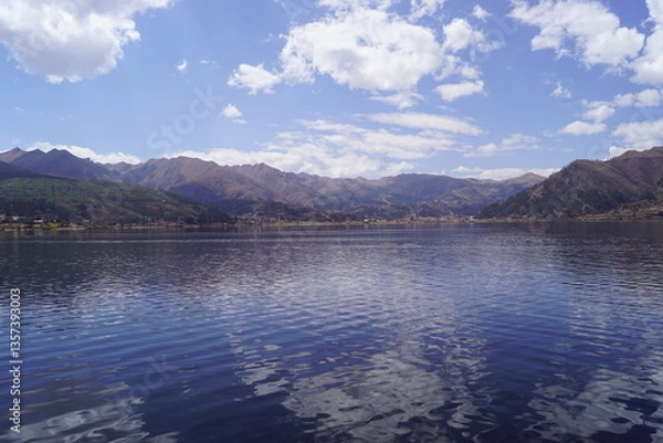 Obraz Kayaking in Polynesian kayaks in the Laguna Piuray lake surrounded by the andes mountains near Cusco, Peru