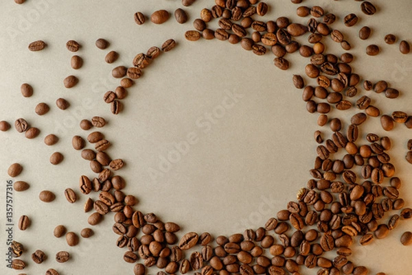 Obraz Creating art with coffee beans on a rustic surface at dawn