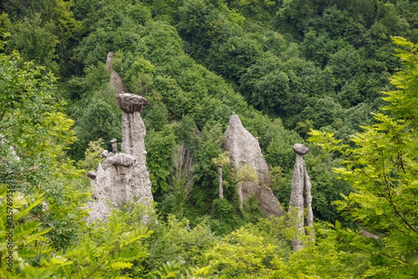 Fototapeta Rock formations, also known as fairy chimneys, earth pyramids, hoodoos, Piramidi di Zone, Italy