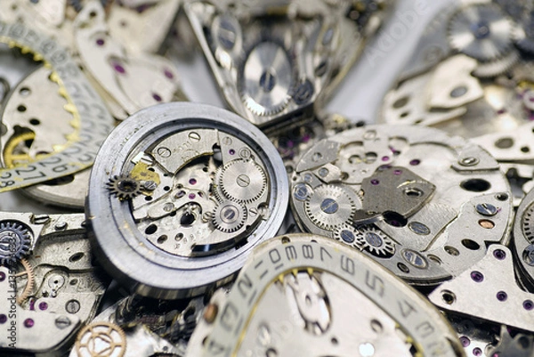 Fototapeta Old mechanical watches with gears and cogs. Watch or clock mechanisms