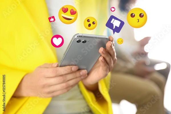 Fototapeta Social media. Woman using mobile phone, closeup. Different notification signs and emojis near gadget