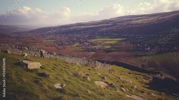 Obraz Stone wall overlooks a valley town nestled in hills
