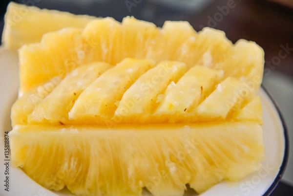 Fototapeta Close-up flesh of a pineapple slice.