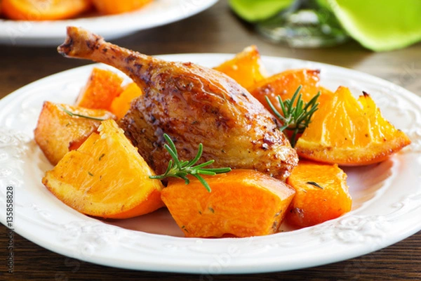 Fototapeta Roast duck with pumpkin and oranges.