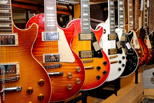 Obraz design fashionable electric guitars on the counter in the store