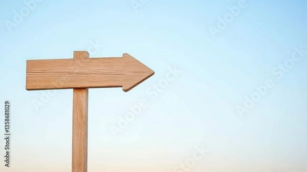 Fototapeta Wooden Arrow Signpost Against Gradient Sky, Symbolizing Direction and Simplicity
