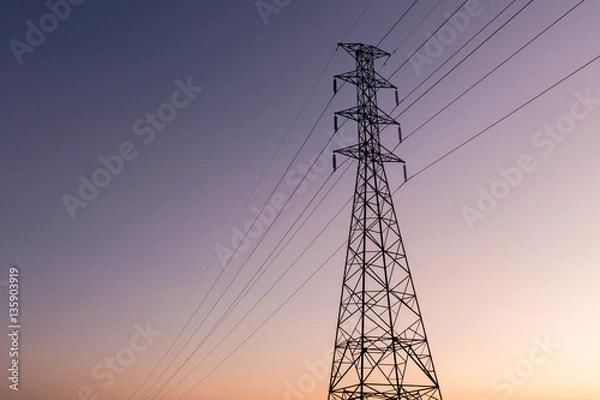 Fototapeta high voltage post.High-voltage tower sunset background.