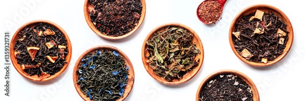 Fototapeta Loose tea leaves with herbs, flowers, and fruit panorama. Black, green, and white teas, and infusions, overhead flat lay panoramic shot on white