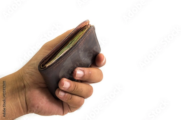 Obraz ฺBroke man showing his brown leather wallet with no money on a poor economy day