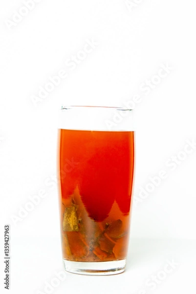Obraz Wedang Uwuh, Healthy Drink from Indonesia that contain rock sugar, ginger, cinnamon leaves, clove leaves, nutmeg leaves, Biancaea sappan. "Wedang" means drink and "Uwuh" means rubbish