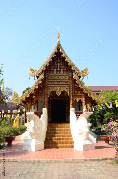 Fototapeta Ancient antique Ubosot Wihan Kaew for thai travelers people travel visit respect praying blessing buddha wish myth holy at Wat Phra Singh or Phra Sing temple at Chiangrai city in Chiang Rai, Thailand