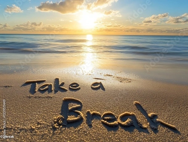 Fototapeta Sunset Beach Scene with "Take a Break" Written in Sand