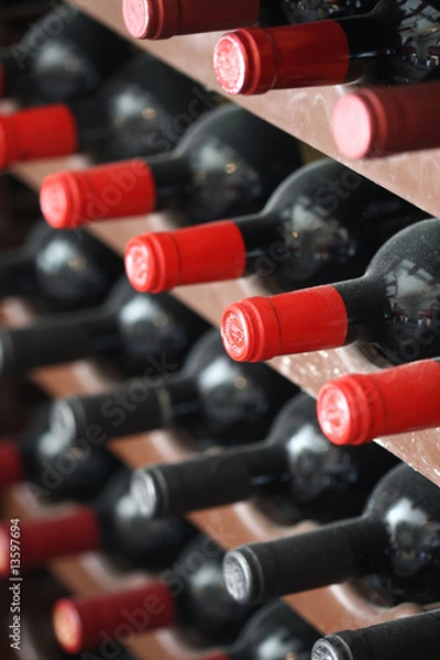 Fototapeta wine bottles with red tops