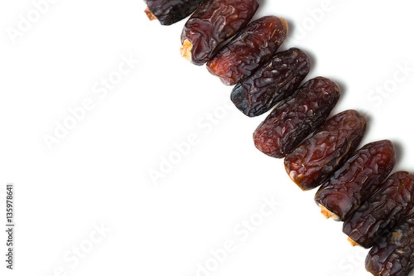Fototapeta A dried dates isolated over white background