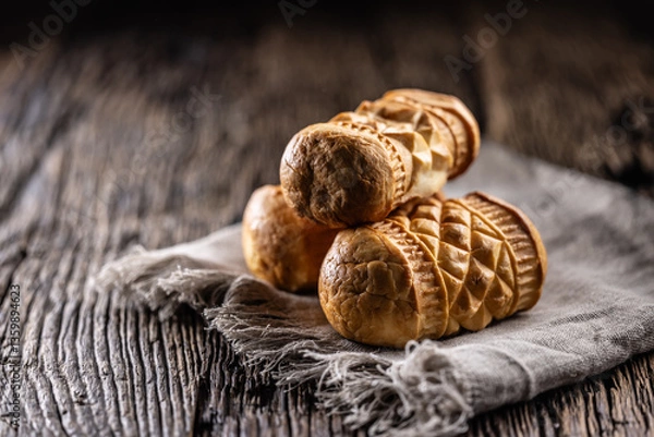 Fototapeta Oscypki - Traditional salty smoked cheese made from sheep's milk from the Polish region of Zakopane under the High Tatras